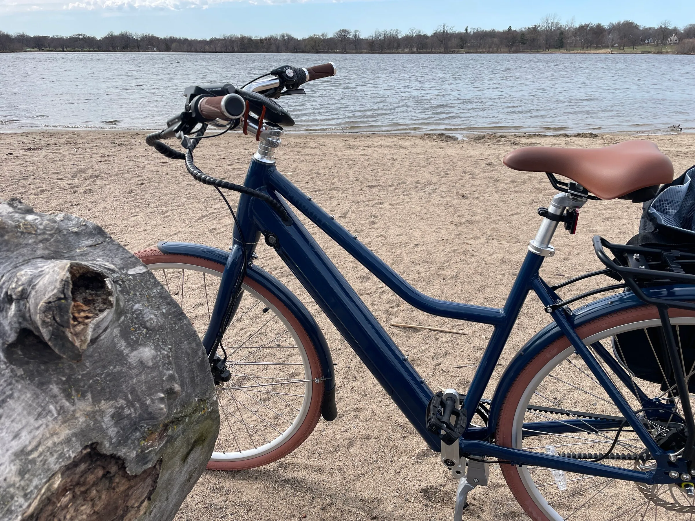 An electric bike parked on the beach of Lake Hiawatha