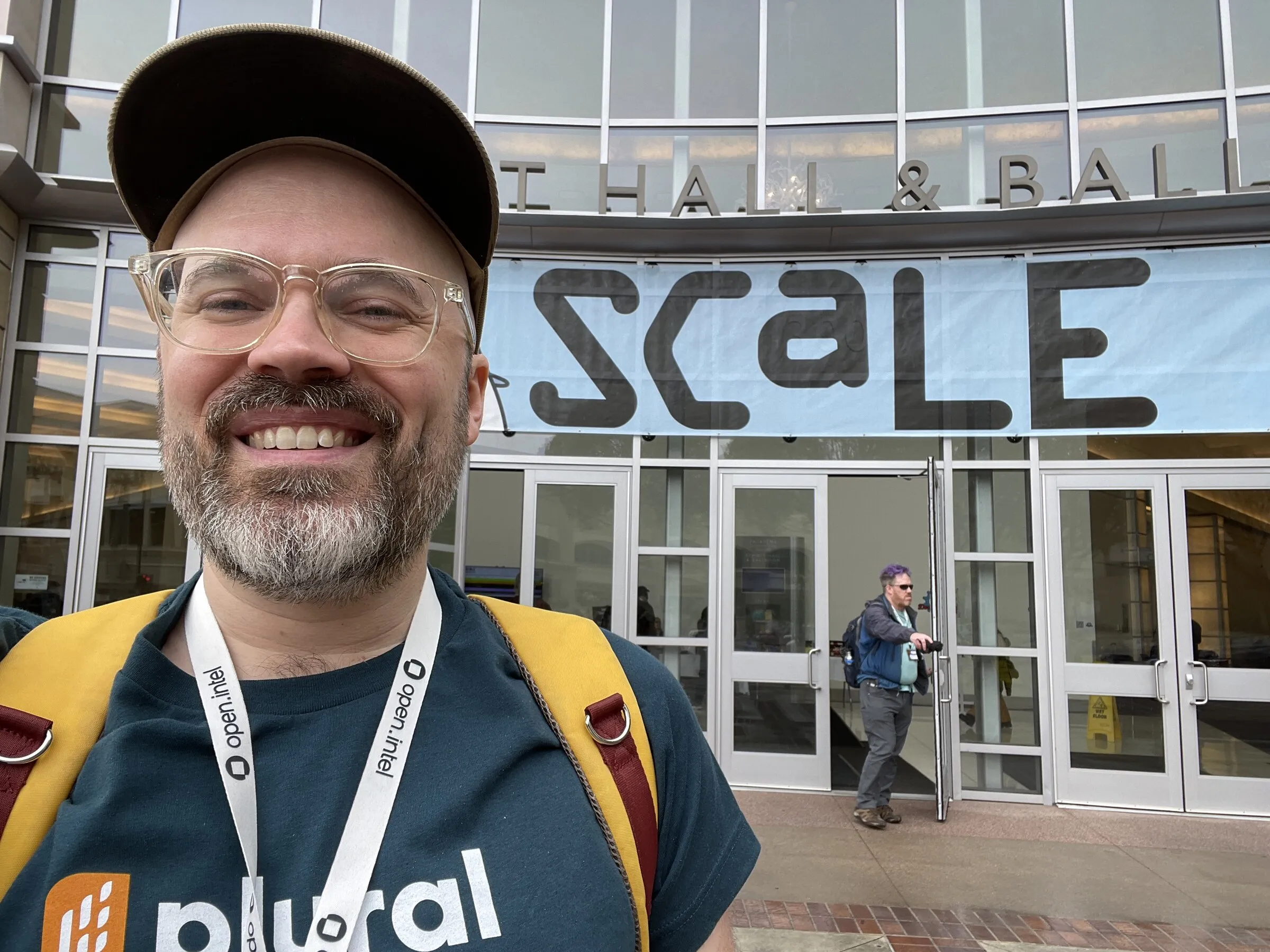 Jesse standing in front of the SCaLE conference sign